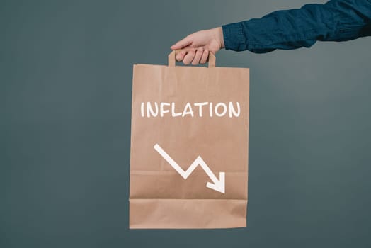 Inflation and financial crash, man holding empty shopping bag, economic development and increasing prices for food and energy