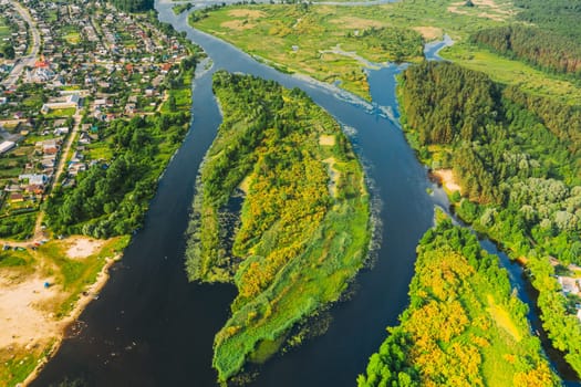Aerial View Of Summer River Landscape In Sunny Summer Day. Top View Of Beautiful European Nature From High Attitude In Summer Season. Drone View. Bird's Eye View. Small Town Or Village And Natural River Island.