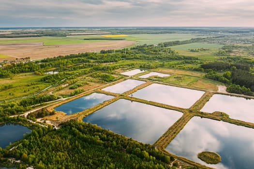 Aerial View Retention Basins, Wet Pond, Wet Detention Basin Or Stormwater Management Pond, Is An Artificial Pond With Vegetation Around The Perimeter, And Includes A Permanent Pool Of Water In Its Design.