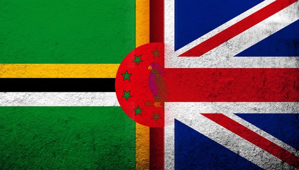National flag of United Kingdom (Great Britain) Union Jack with Commonwealth of Dominica National flag. Grunge background