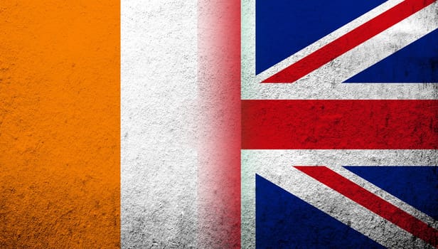 National flag of United Kingdom (Great Britain) Union Jack with Cote dIvoire (Ivory Coast) National flag. Grunge background