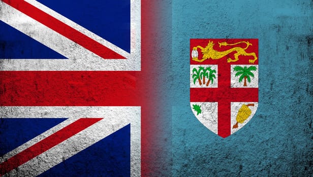 National flag of United Kingdom (Great Britain) Union Jack with Fiji National flag. Grunge background