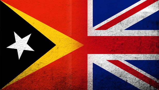National flag of United Kingdom (Great Britain) Union Jack with Republic of Timor-Leste (East Timor) National flag. Grunge background