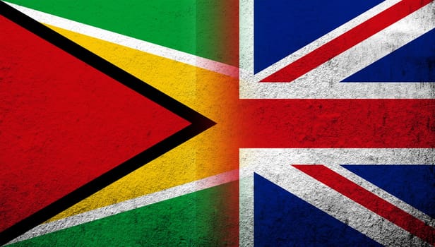 National flag of United Kingdom (Great Britain) Union Jack with Republic of Guyana National flag. Grunge background