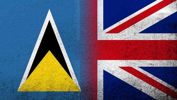 National flag of United Kingdom (Great Britain) Union Jack with National flag of Saint Lucia. Grunge background