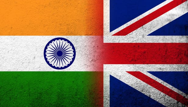 National flag of United Kingdom (Great Britain) Union Jack with The Republic of India National flag. Grunge background