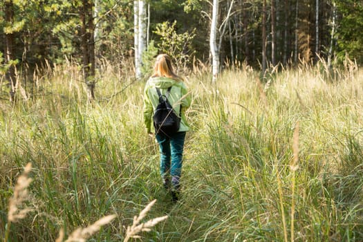 Woman play Geocaching. Walk in deep forest.