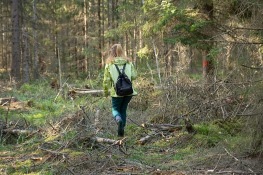 Woman play Geocaching. Walk in deep forest.