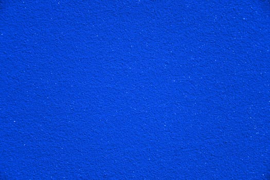 A very intense blue color with sparkling elements as a background. The deep blue is reminiscent of a sparkling and glittering starry sky.
