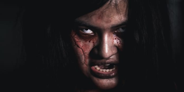 Horror bloodthirsty woman ghost or zombie she is horror scary with open mouth at dark night, Screaming zombie female broken face with blood, Happy halloween day festival concept