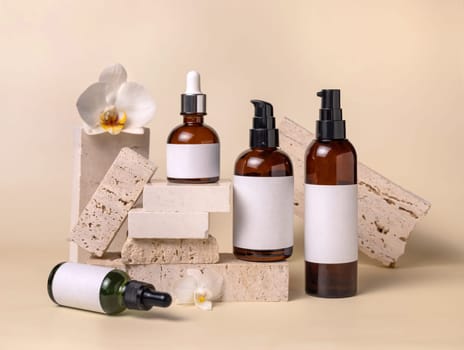 Dark glass bottles with blank labels near white orchid flowers and stones on light beige, close up, package mockup. Skincare beauty products, serum, tonic or lotion. Exotic natural cosmetics..