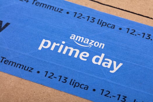 WETZLAR, GERMANY - 2022-07-16: Amazon Prime logotype printed on cardboard box security scotch tape. Amazon Prime is a service from Amazon which delivers parcels in 1 day.