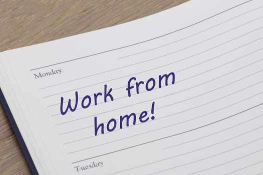 A Work from home diary reminder appointment open on desk