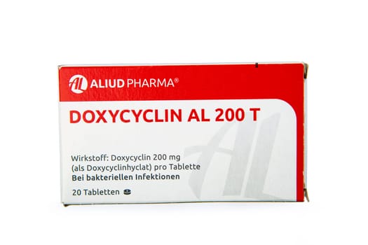 WETZLAR, GERMANY 2022-07-25: Doxycycline antibiotics pills in a cardbox over white background