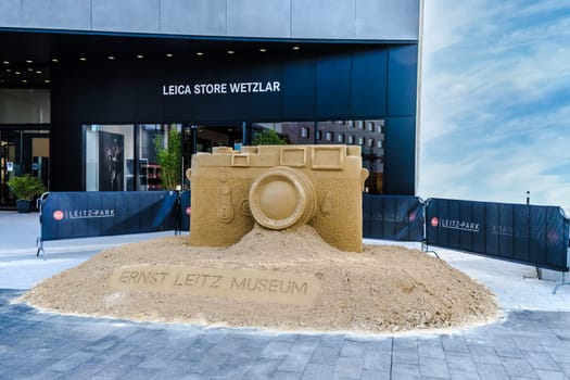 WETZLAR, GERMANY - 2021-10-01: Leica Store in Wetzlar with artwork, Leica camera modeled from sand.