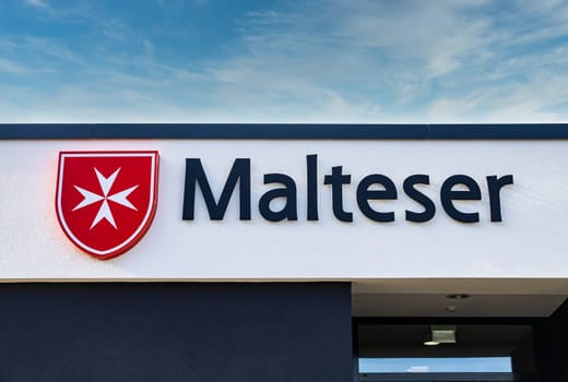 WETZLAR, GERMANY 2021-10-01: Malteser Logo. Malteser is an international non-governmental aid agency for humanitarian aid of the Sovereign Military Order of Malta.