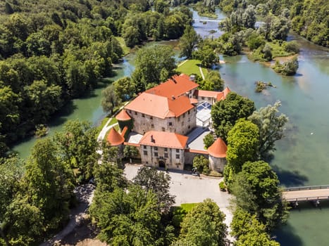 Romantic Otocec Castle on Krka River in Slovenia. Drone View