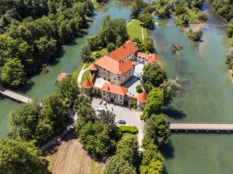 Romantic Otocec Castle on Krka River in Slovenia. Drone View