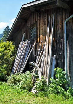 Wooden shed on a meadow under a blue sky