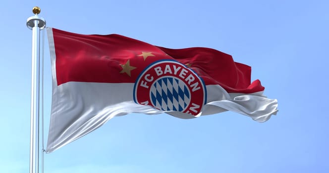 Munich, GER, May 2022: The Bayern Munich Flag waving in the wind on a clear day. Bayern Munich is a German sports club based in Munich