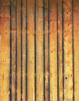 Wooden wall under a blue sky in summer