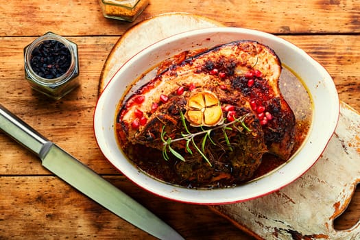 Tasty fried pork belly with spices and herbs. Fatty piece of meat. Copy space