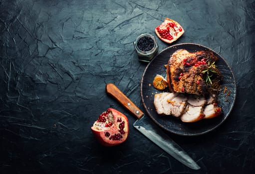 Tasty fried pork belly with spices and herbs. Fatty piece of meat. Copy space