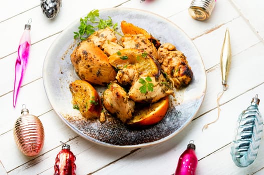 Chicken breast baked in orange sauce. Food for Christmas.