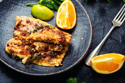 Fish fillet grilled with orange, delicious seafood.