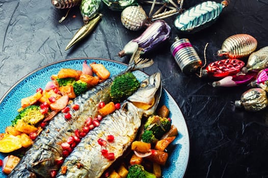 Baked whole fish with pineapple, broccoli and pomegranate. Grilled mackerel
