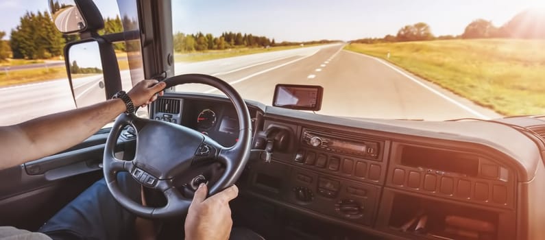 Driver of semi-truck sitting and drining his vehicle. Concept of shipping and delivering.