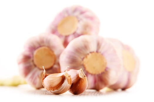 Composition with bulbs of garlic isolated on white background