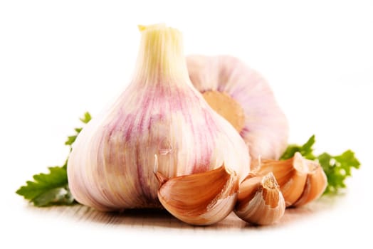 Composition with bulbs of garlic isolated on white background