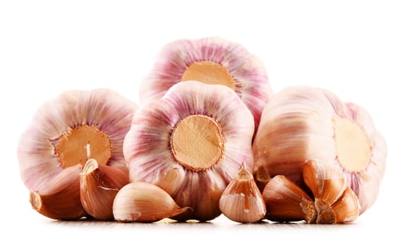 Composition with bulbs of garlic isolated on white background