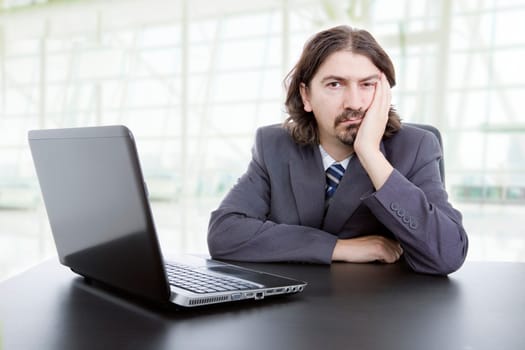business man working with is laptop, at the office