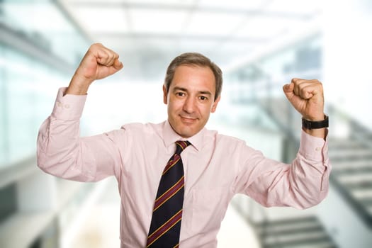 successful business man with open arms as a winner