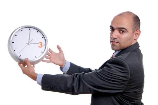 A handsome business man holding a clock