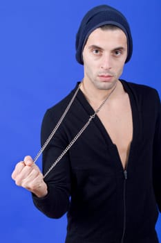 an casual young man portrait over a blue background
