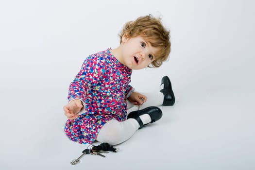 young baby portrait on a grey background