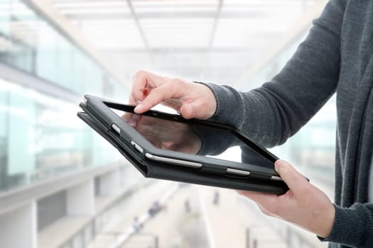 businesswoman using touch pad, close up shot on tablet pc, at the office