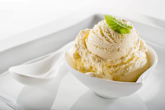 Ice cream in bowl on white background
