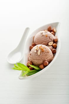 Fresh hazelnut ice cream on plate close up