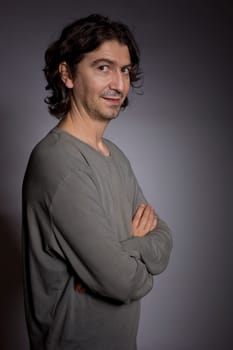 young casual man portrait in a dark background