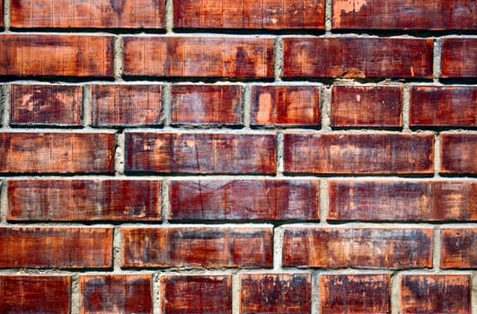 The grunge olden colored brick wall texture