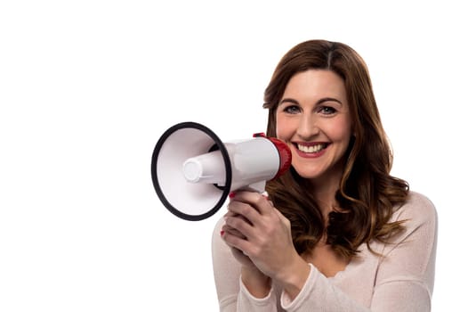 Cheerful woman posing with loudhailer