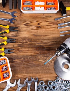 Working tools on wooden background