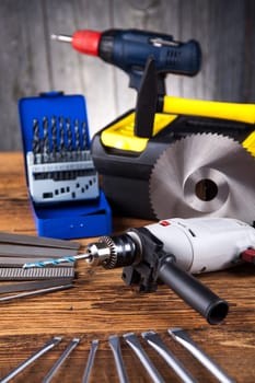 Set of different tools on wooden background