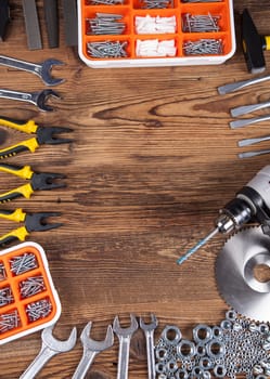 Set of different tools on wooden background