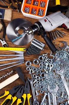 Set of different tools on wooden background