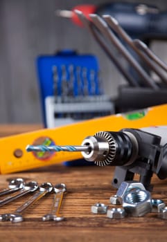 Set of different tools on wooden background